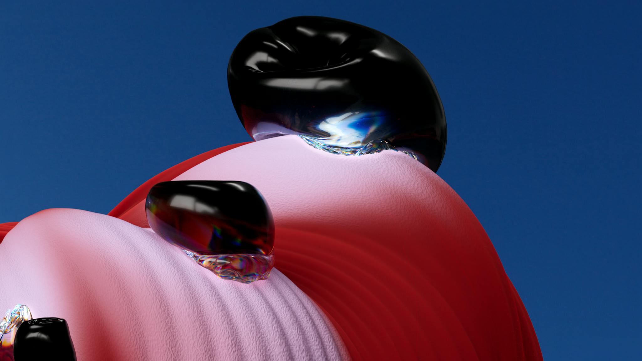 Colorful abstract 3D render featuring glossy black spheres against a blue sky background.